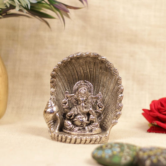 Metal Ganesha Sitting on Nag Singhasan